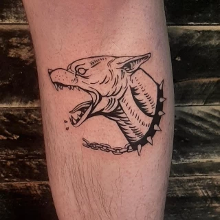 Raging Dog on leg Tattoo - Black Hat Tattoo Dublin - The Black Hat Tattoo