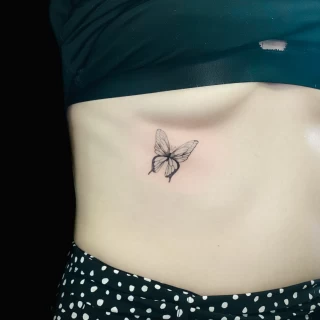 Very small butterfly tattoo  - Black Hat Tattoo Dublin - The Black Hat Tattoo