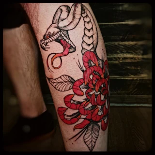 Snake and flowers on leg - Snake Tattoo - Black Hat Tattoo Dublin - The Black Hat Tattoo